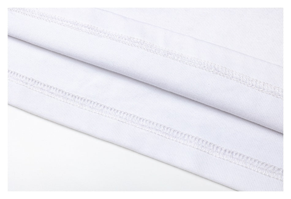 Close-up of stitching and fabric along the white shirt's folded hem.