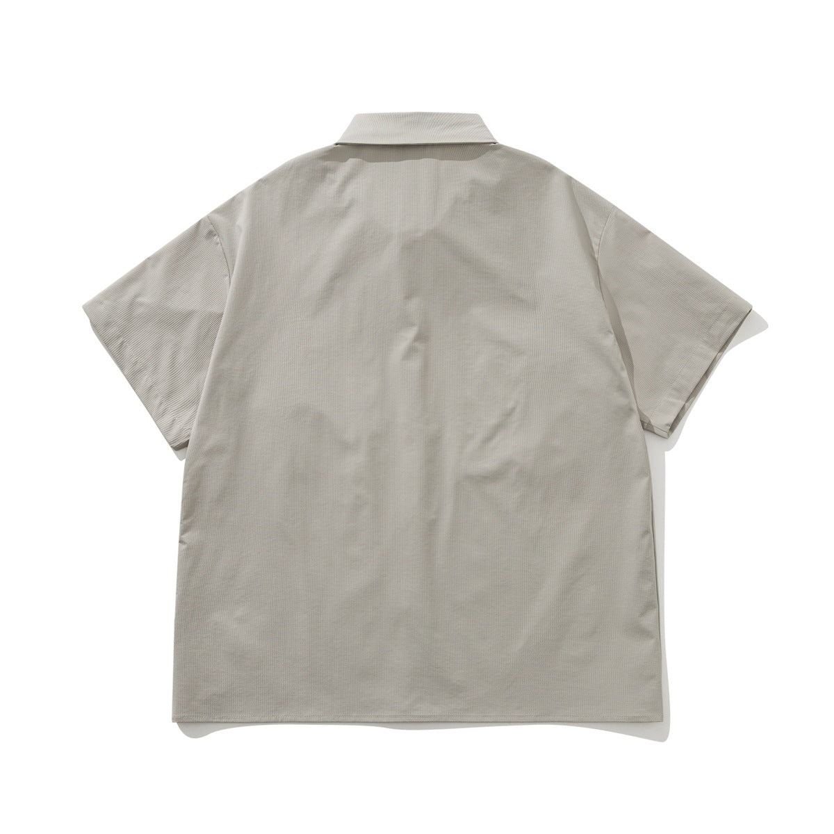 Back view of a light gray short-sleeve button-up shirt with a collar and plain back.