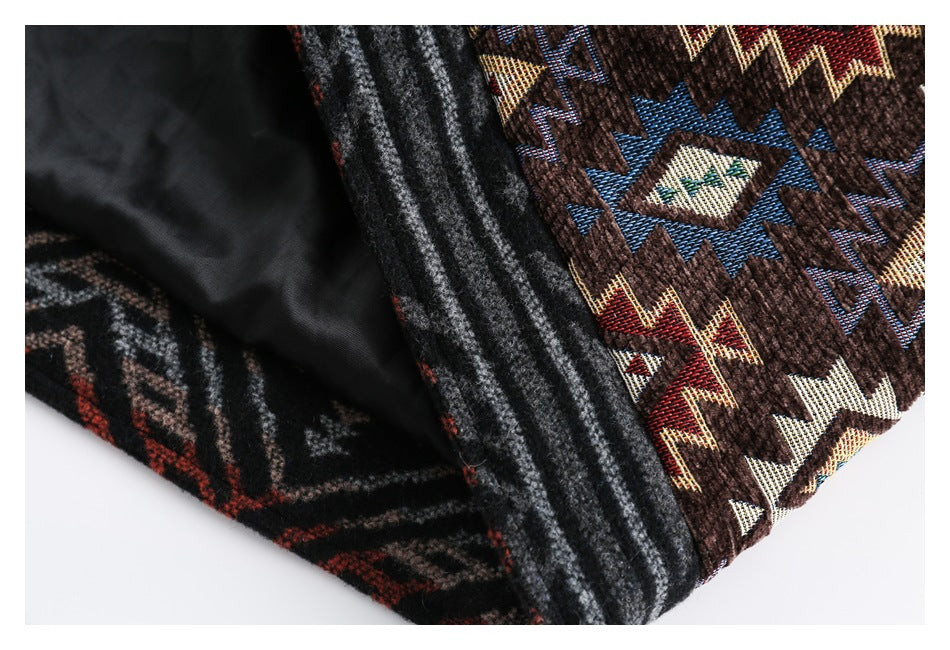 Close-up showing the dark lining, striped plaid edge, and geometric brown patterned fabric of a garment.