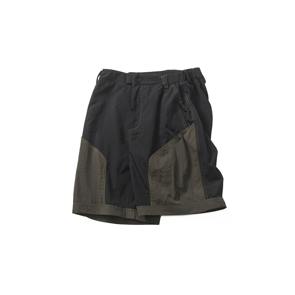 Front view of charcoal shorts with olive-toned contrast panels, a button waist, elastic side sections, and contrast