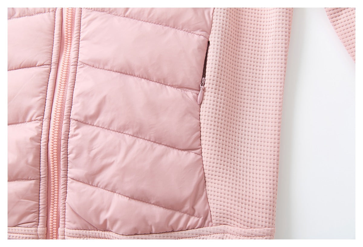 Close-up of a pink jacket showing its quilted front, textured side panel, and slim zip pocket.