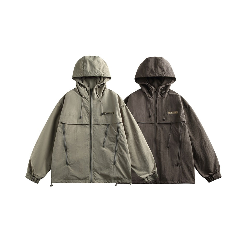 Two hooded zip jackets shown side by side in sage gray and dark charcoal.