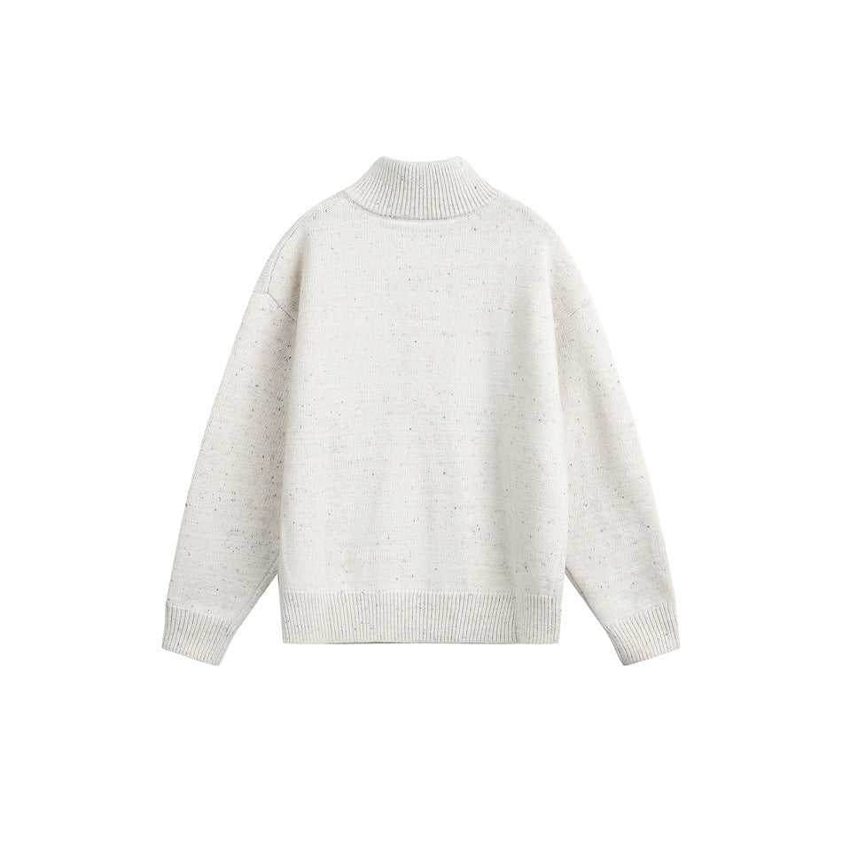 Cream speckled knit pullover sweater, flat back view with stand collar and ribbed hem
