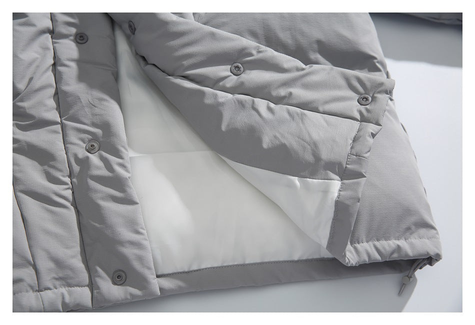Light gray padded jacket opened to show its white lining and inner snap-fastened front.