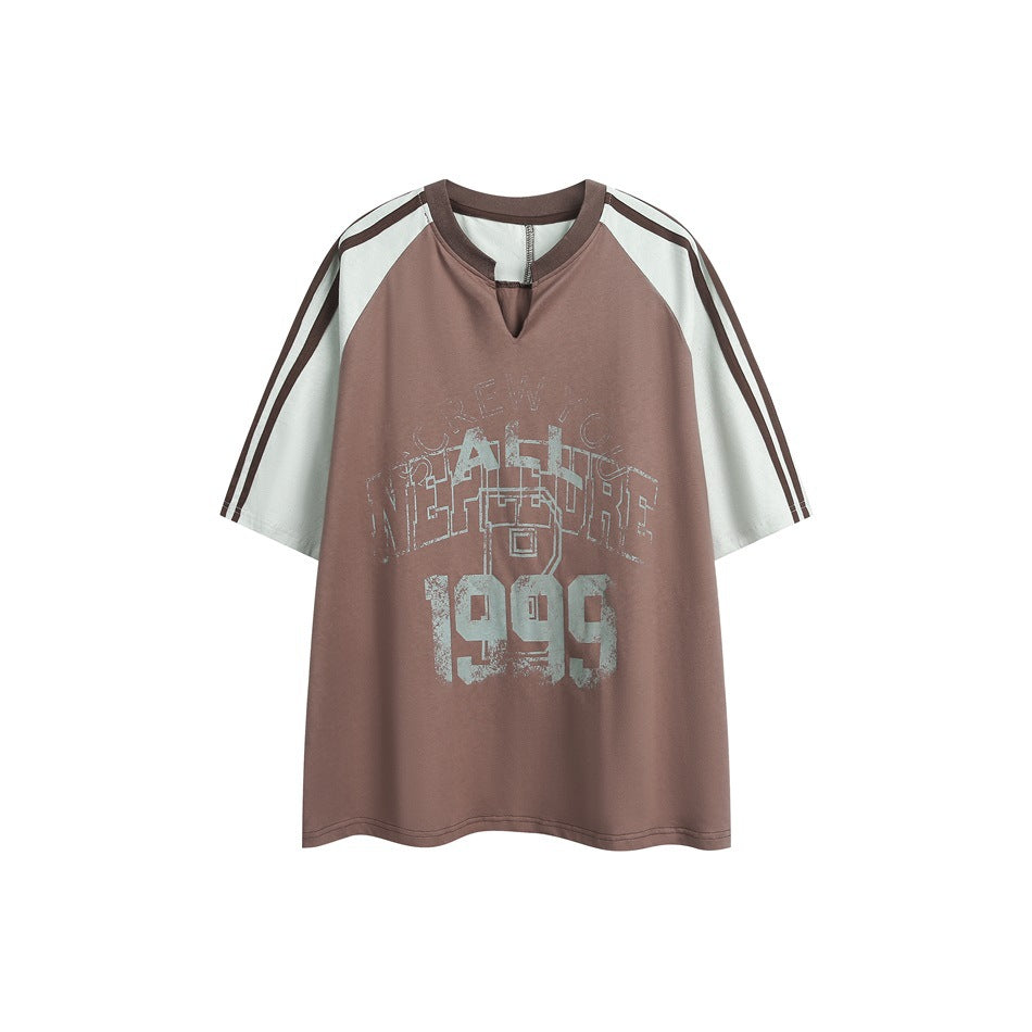 Brown and pale sage color-block short-sleeve T-shirt with notched V-neck, sleeve stripes and distressed 1999 graphic