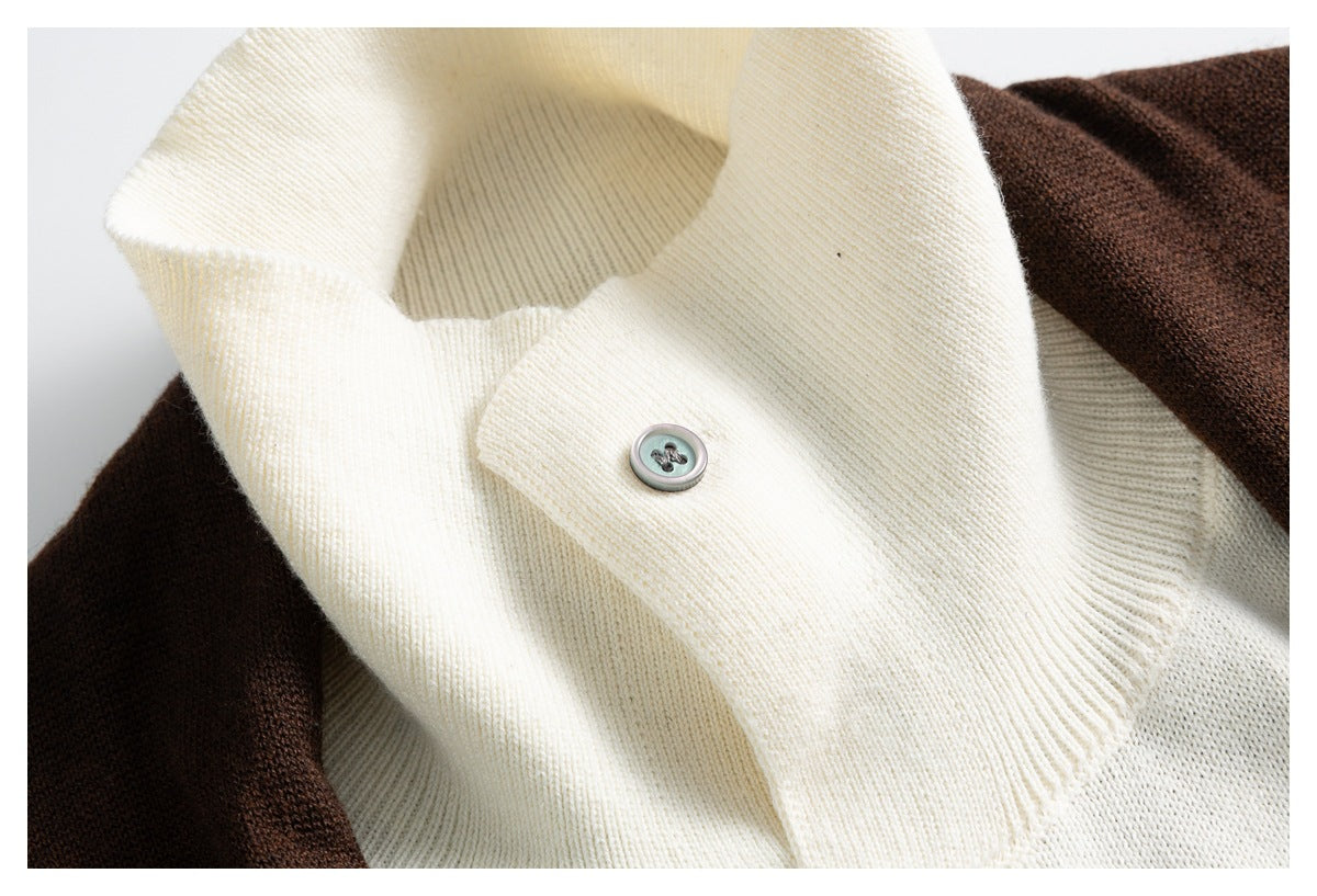 Close-up of the cream ribbed collar and button beside the dark brown cardigan knit.