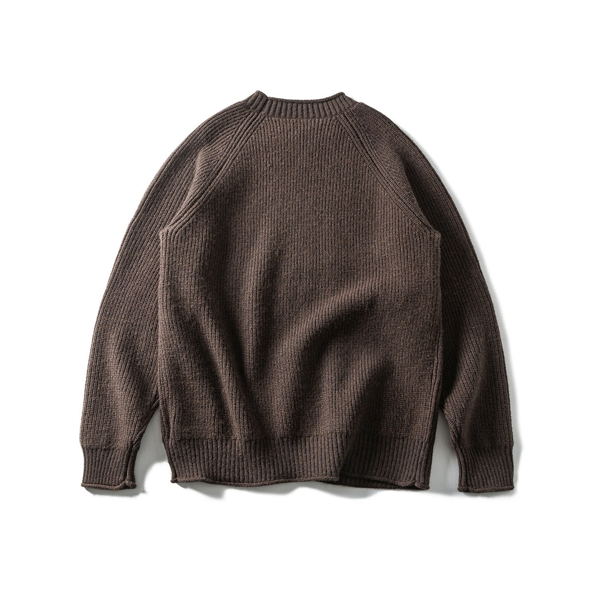 Brown textured crewneck sweater laid flat, front view, with raglan sleeves and ribbed cuffs, collar and hem.