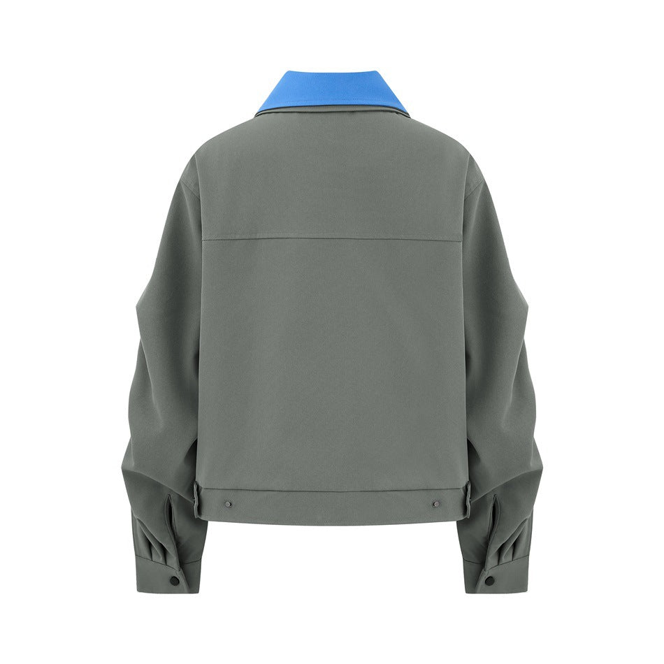 Back view of a gray-green jacket with a bright blue collar, stitched back panel, and buttoned cuffs.