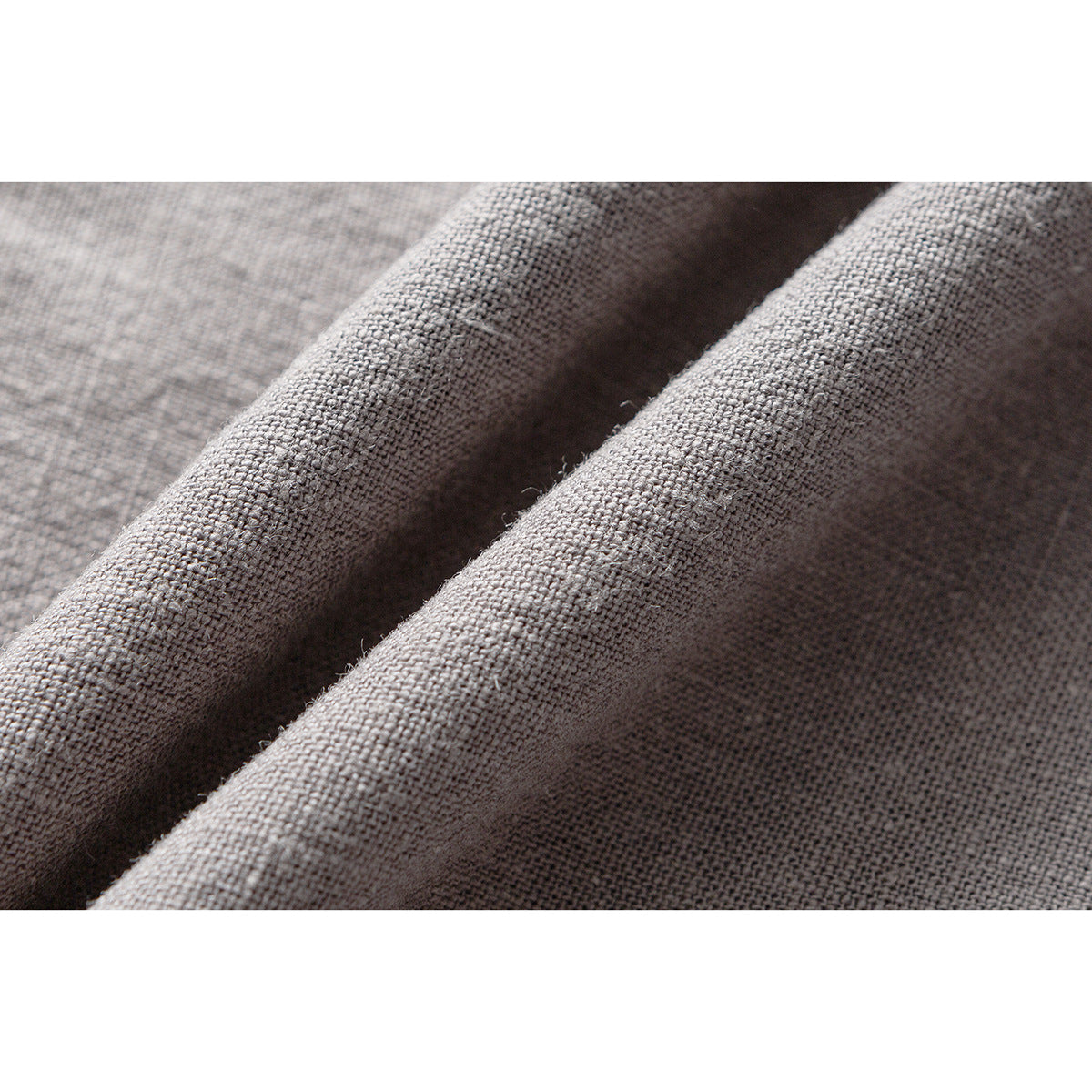 Macro view of gray-brown fabric showing its coarse, visible woven texture.