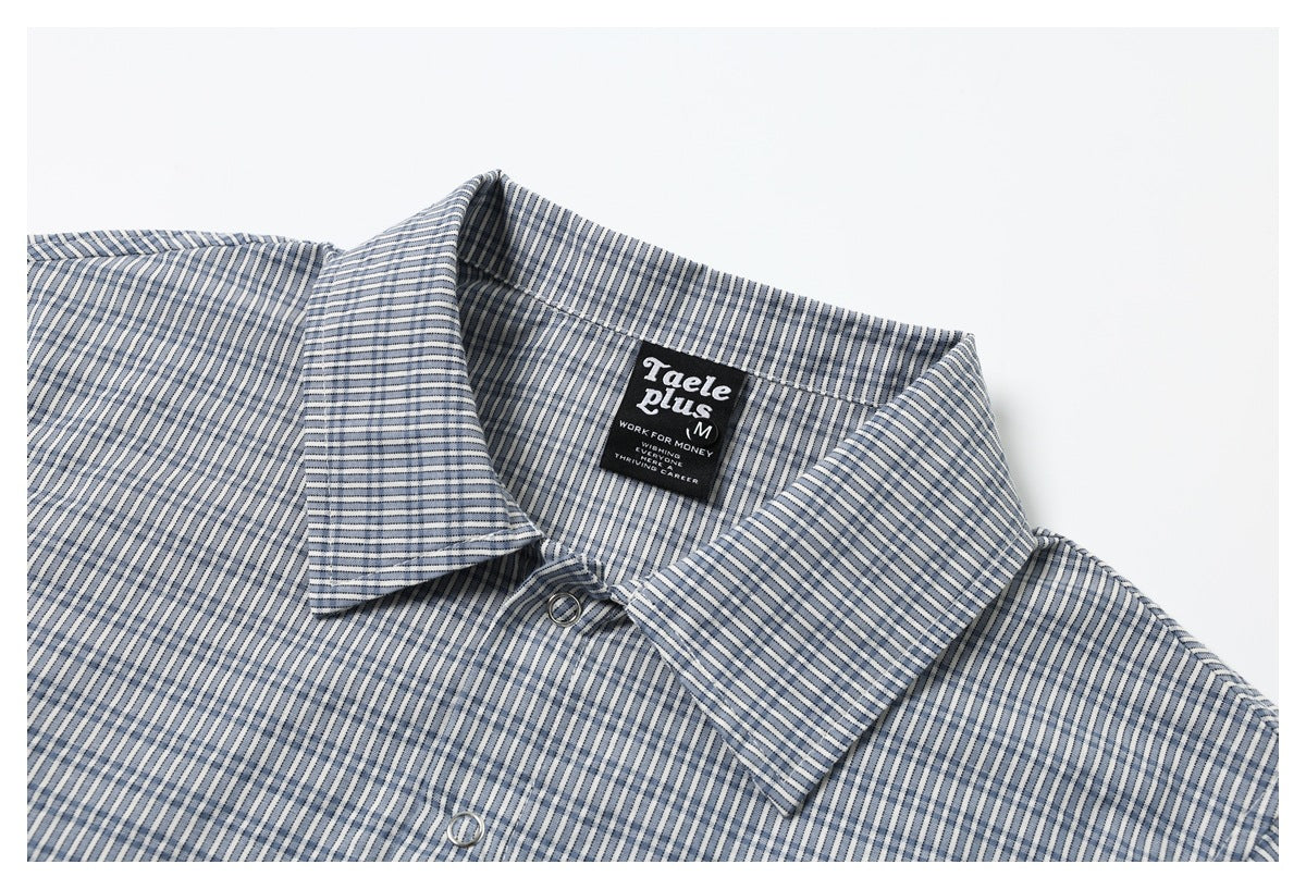 Close-up of the checked shirt collar, front buttons, and sewn neck label.