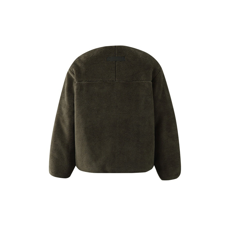 Back of a dark olive fleece jacket, with a yoke seam and small black tab near the collar.