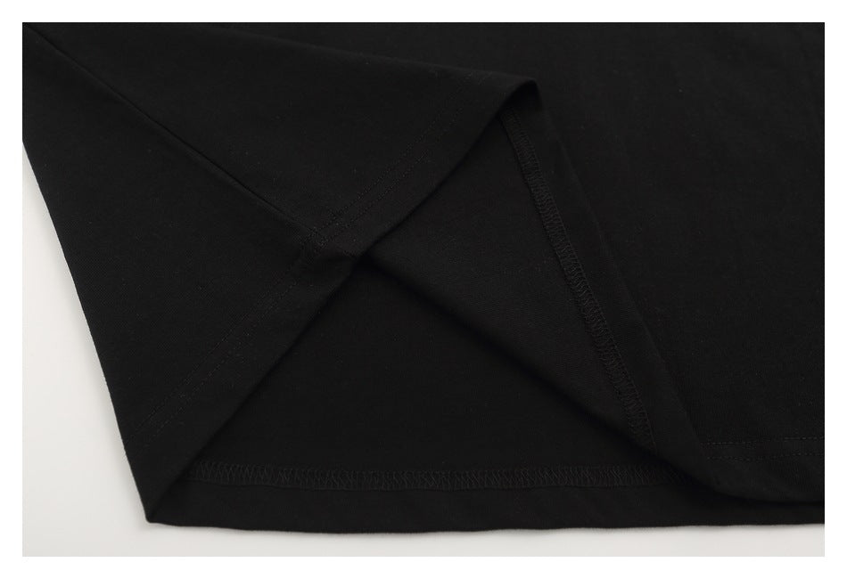 Close-up of the black T-shirt's hem and stitched seams.