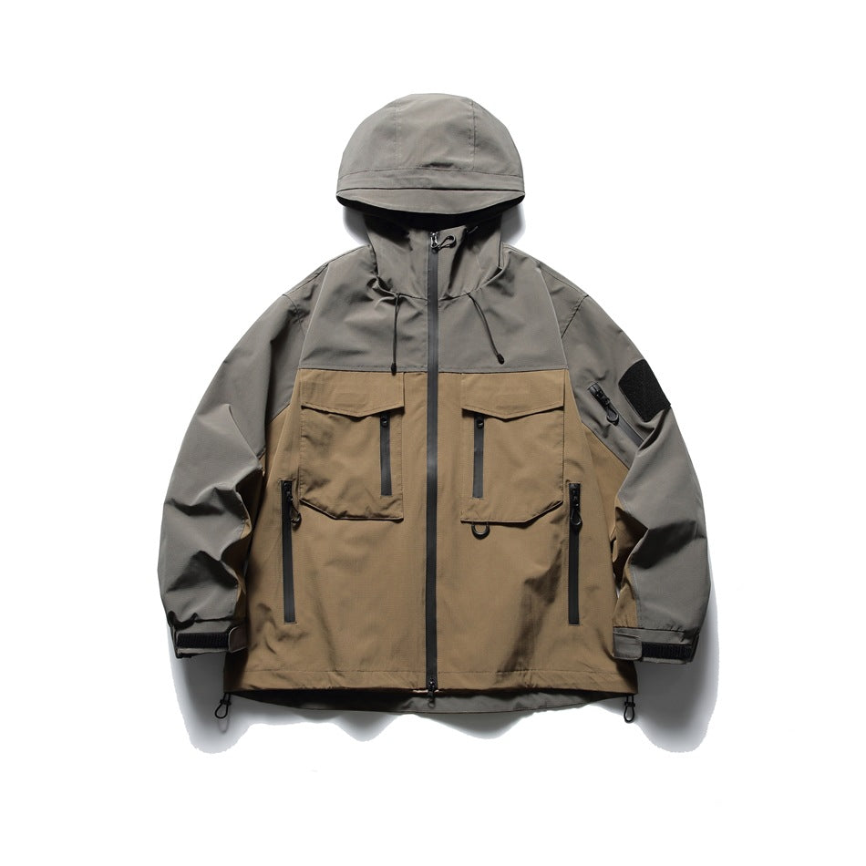 Gray-green and khaki color-block hooded jacket, front view, with flap chest pockets and zip pockets