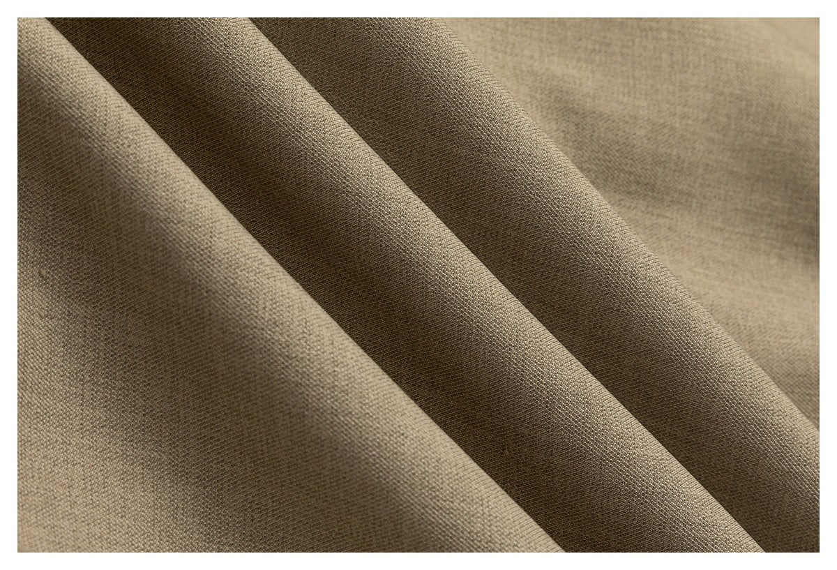 Macro view of taupe fabric texture in deep folds.