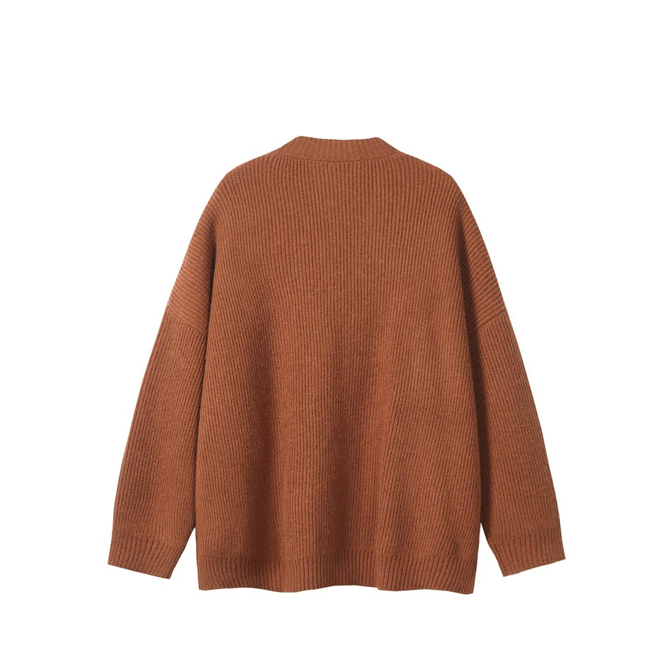 Back view of rust brown ribbed knit cardigan with dropped shoulders and ribbed cuffs and hem