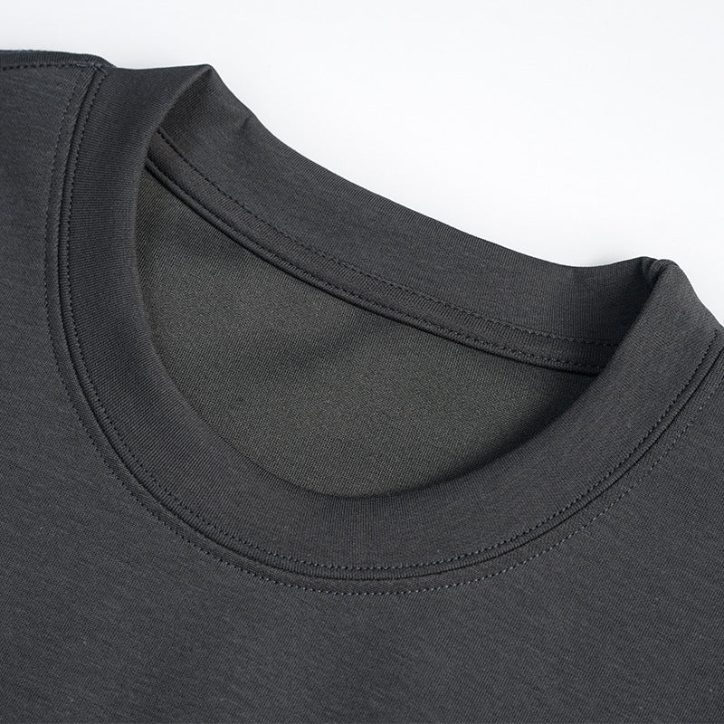 Close-up of a charcoal T-shirt's crew neckline and double-stitched collar.