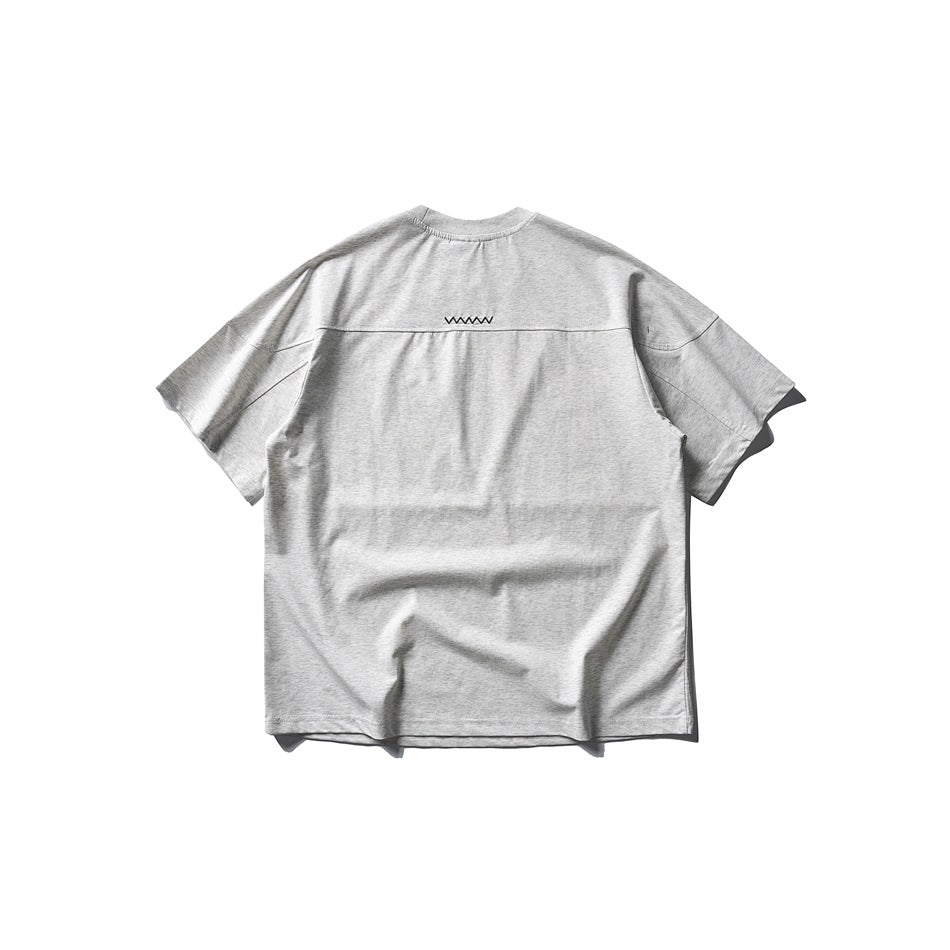 Back view of a light gray melange short-sleeve crew-neck T-shirt with a small zigzag detail across the upper back.