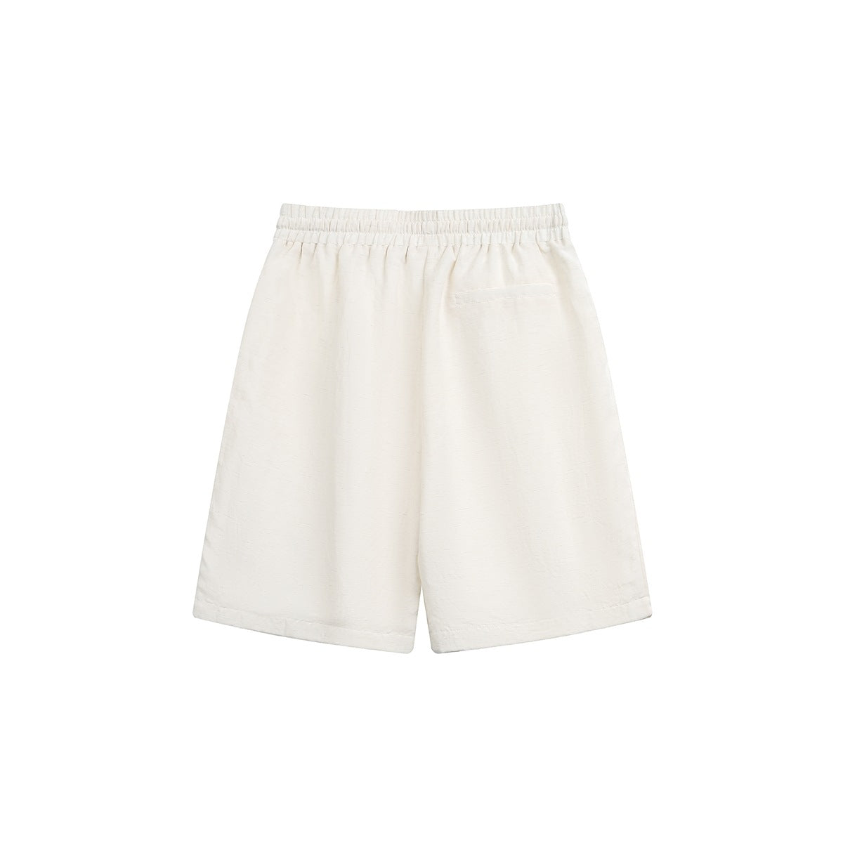 Back view of ivory shorts with an elastic waistband, a single welt pocket, and wide legs.
