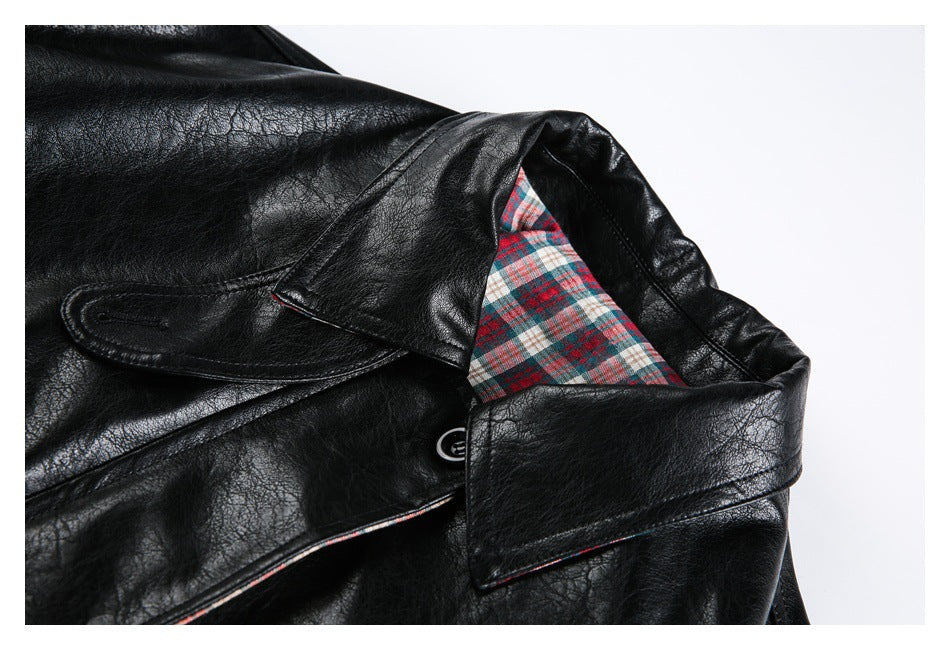Close-up of the jacket's black collar and red, teal, and white plaid lining.