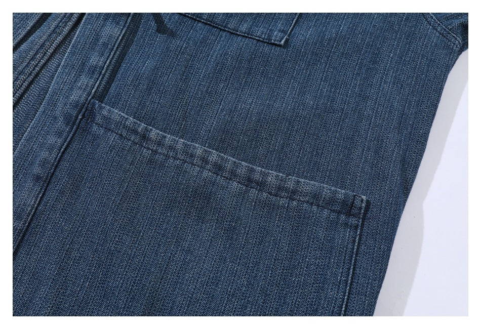 Close-up of a large rectangular patch pocket on dark blue denim.