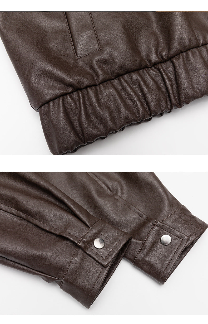 Close-ups of the brown jacket’s elastic hem and snap-button sleeve cuffs.