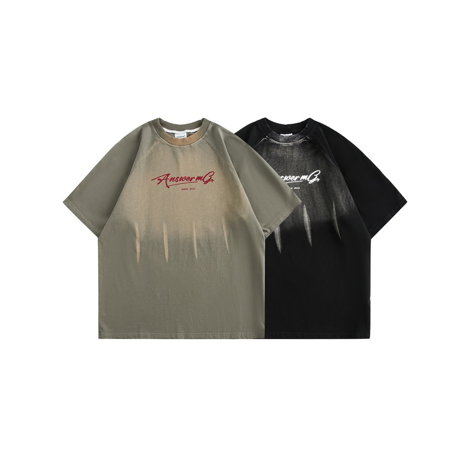Two oversized raglan T-shirts shown together: olive-gray with burgundy print and black with white print.