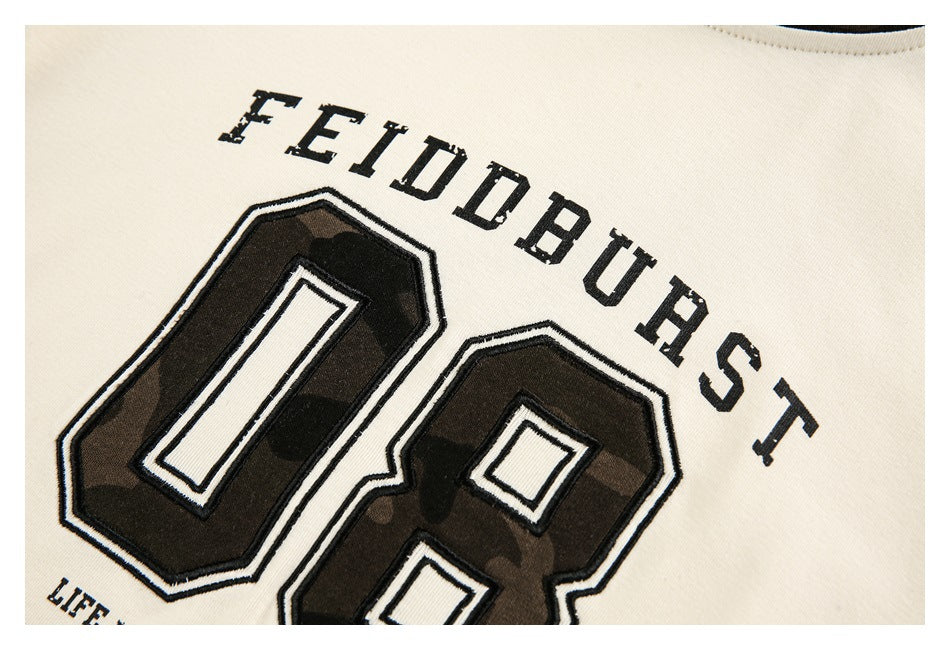 Close-up of the shirt's English chest lettering and outlined camouflage number graphic.