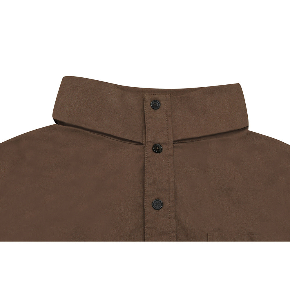 Close-up of a brown shirt’s stand collar and black-button placket.