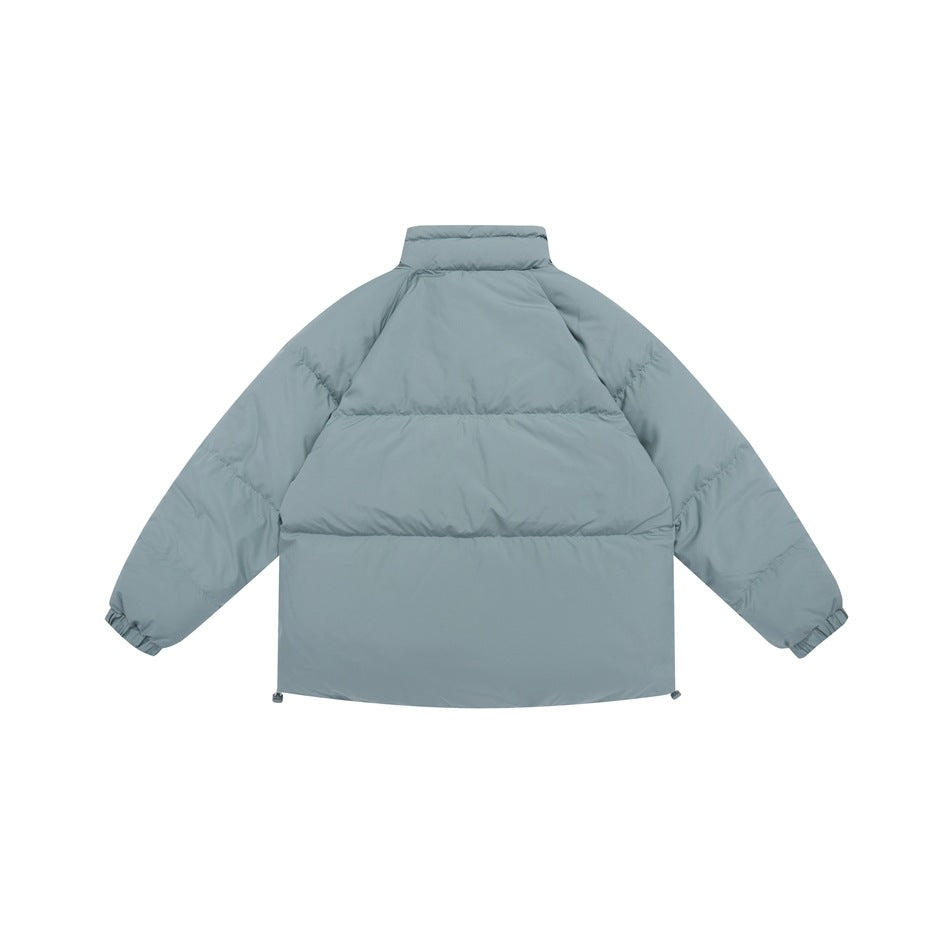 Rear view of a light blue-gray puffer jacket with a raised collar, quilted sleeves and adjustable hem.