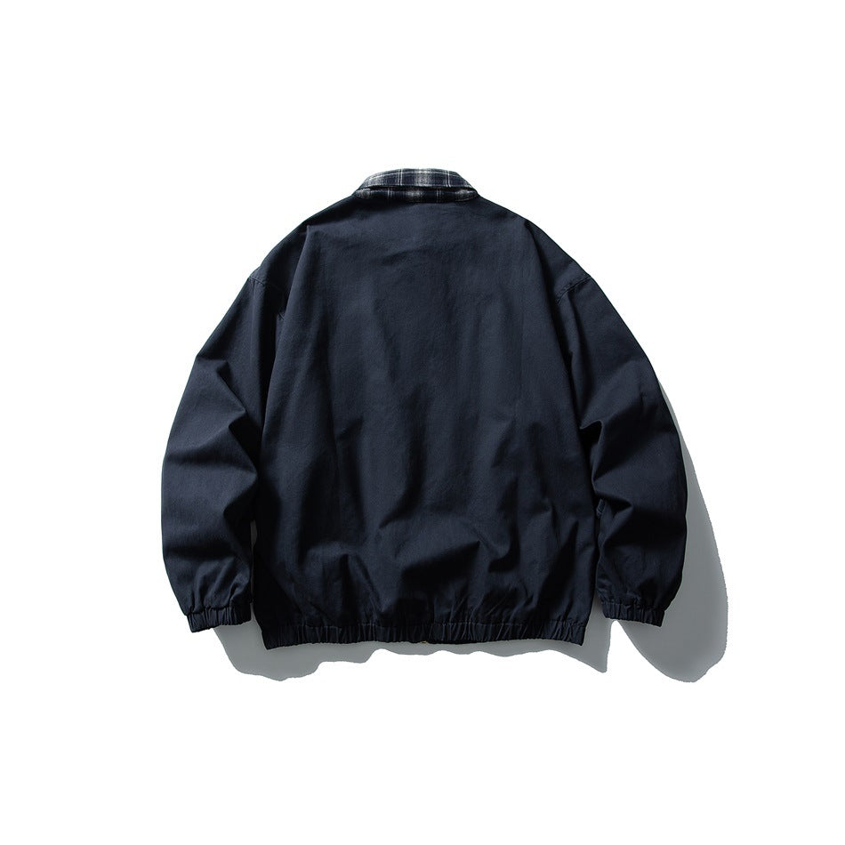 Back view of a navy jacket with a gray plaid collar, elastic cuffs, and gathered hem.