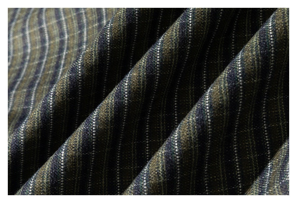 Close-up of dark fabric with fine vertical gray and olive stripes and a woven texture.
