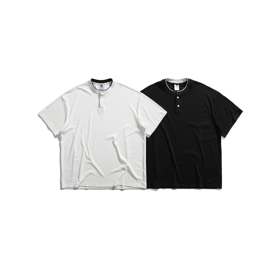Off-white and black short-sleeve ribbed shirts with band collars and button plackets, shown from the front.
