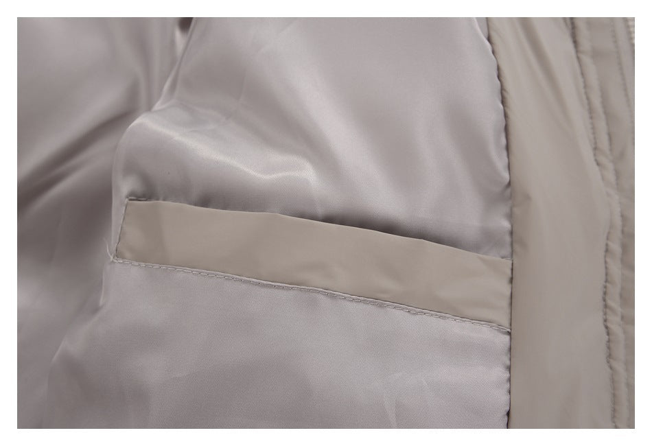 Close-up of the taupe jacket’s light-colored lining and interior pocket.