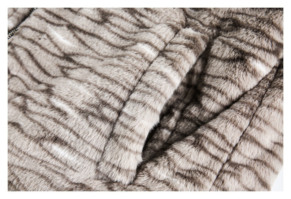 Close-up of the striped fur garment's overlapping front panels and a partially visible zipper.