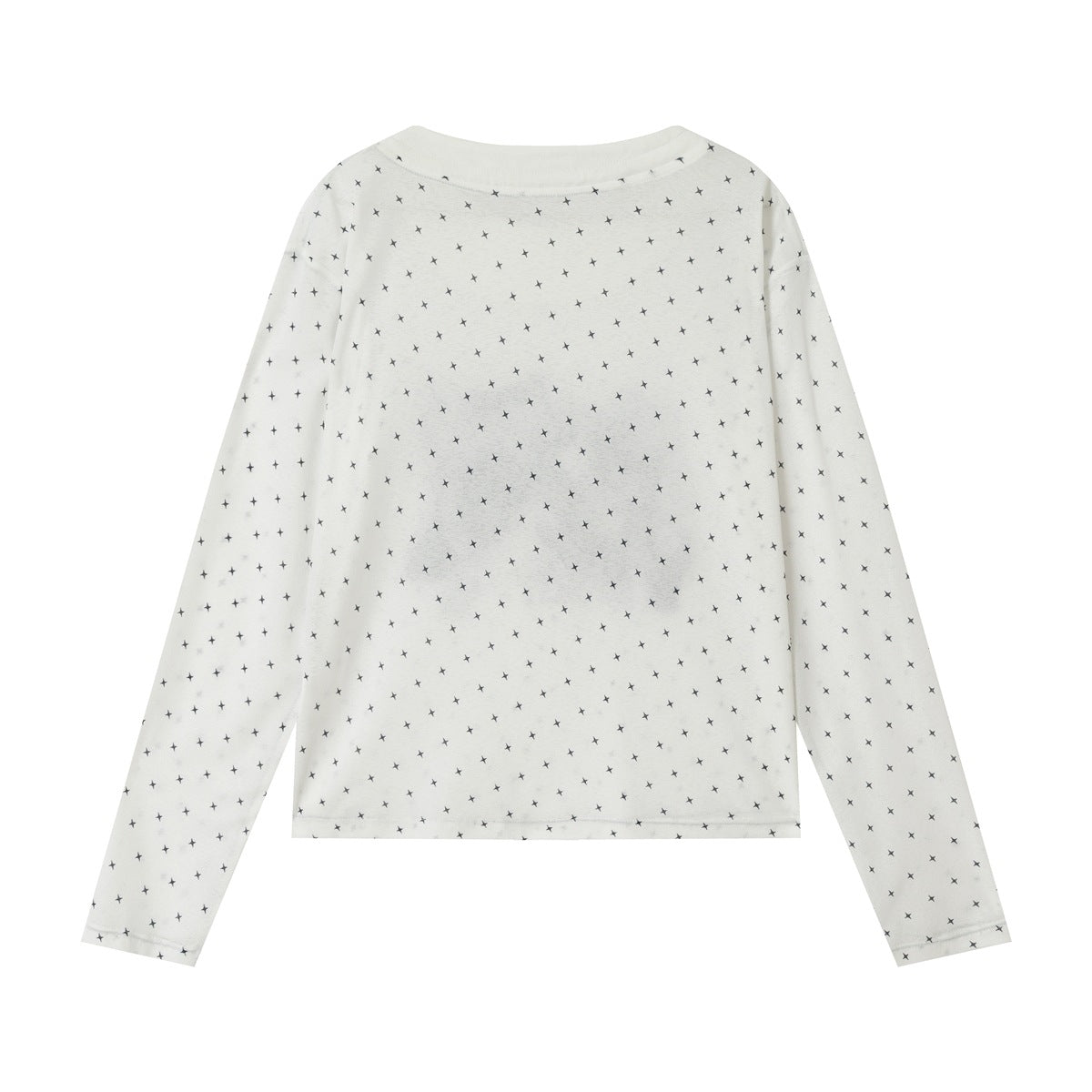 Back of white long-sleeve top with all-over black four-point star print and a faint gray patch