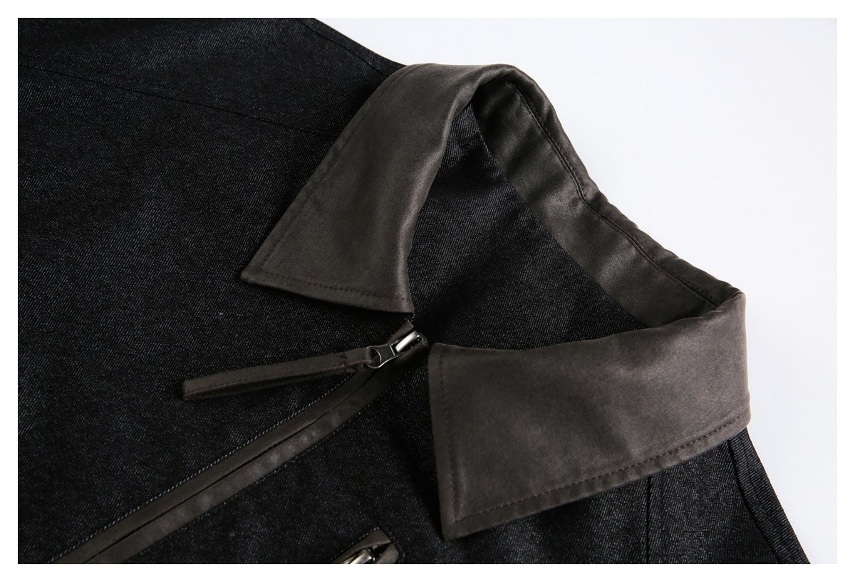 Close-up of the jacket's dark pointed collar and upper front zipper.