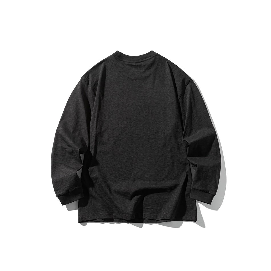 Back view of a black long-sleeve crew-neck shirt laid flat against a white background.