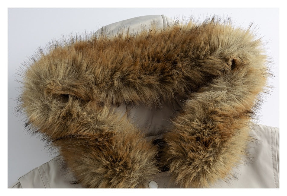 Close-up of the brown and tan fur trim around a light gray jacket hood.