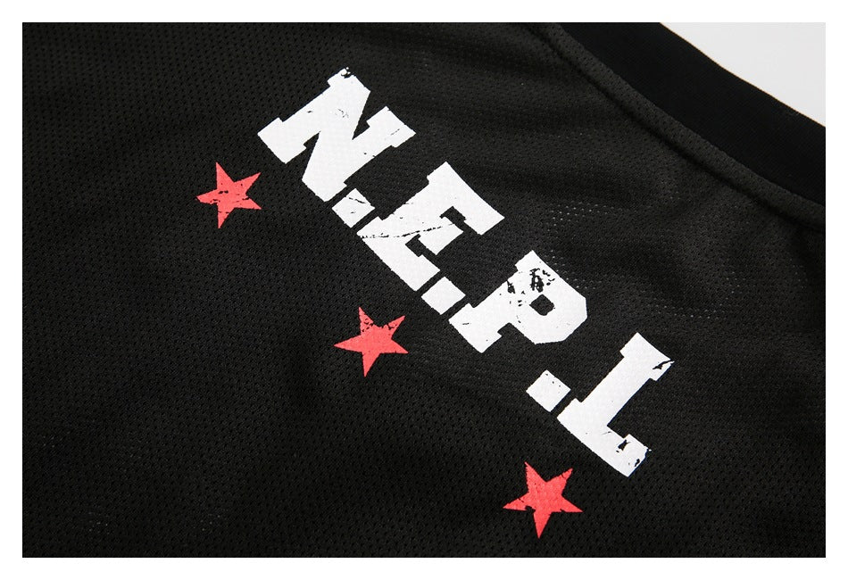 Close-up of black mesh fabric printed with distressed white lettering and three red stars.