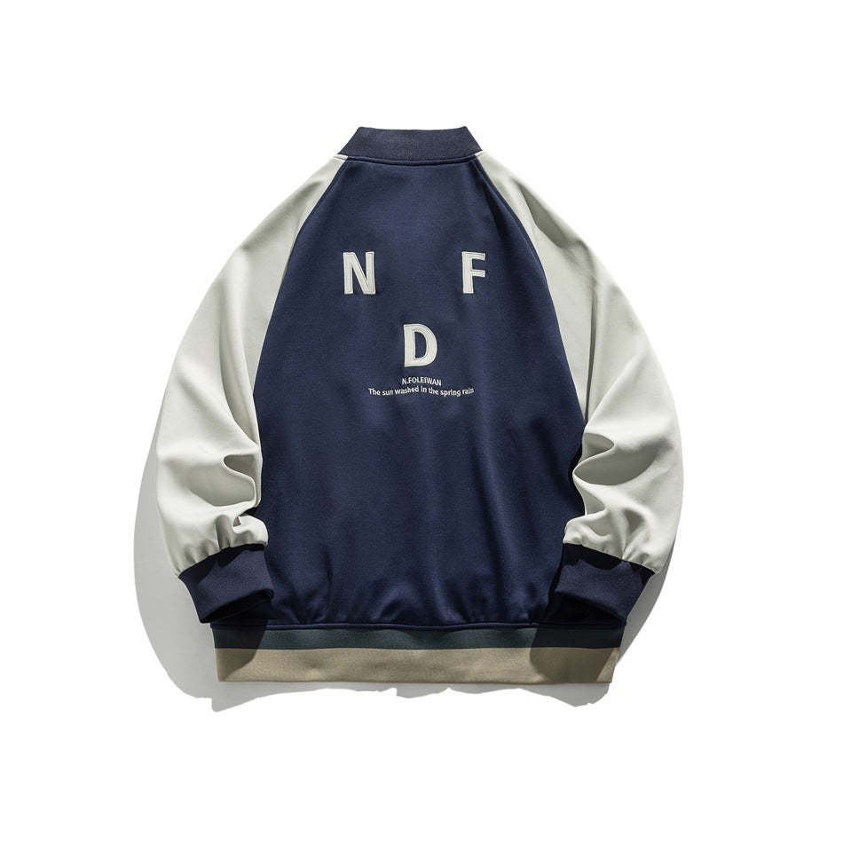 Back of a navy jacket with cream raglan sleeves, ribbed cuffs and hem, and embroidered white lettering.
