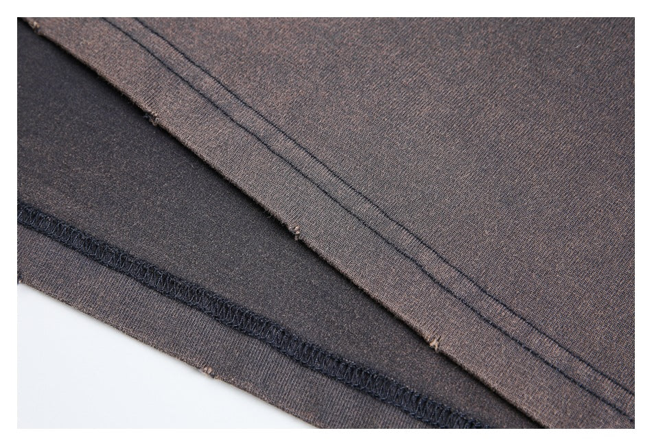 Close-up of the gray T-shirt's hem stitching and inside seam.
