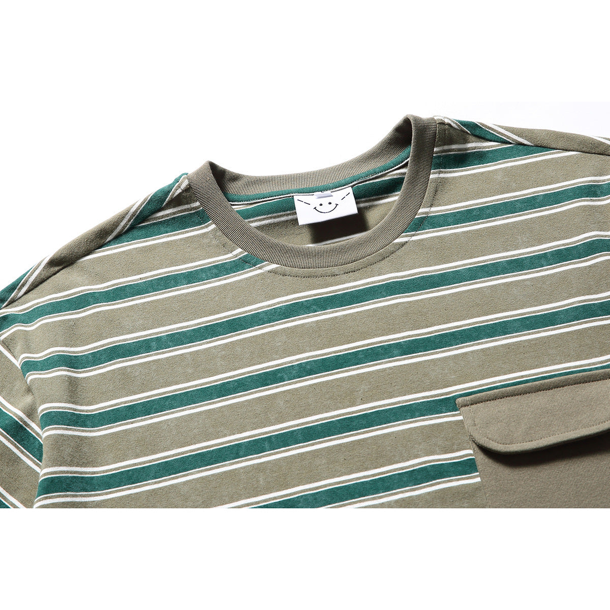 Close-up of a khaki and dark green striped T-shirt neckline and chest pocket with a rounded flap.