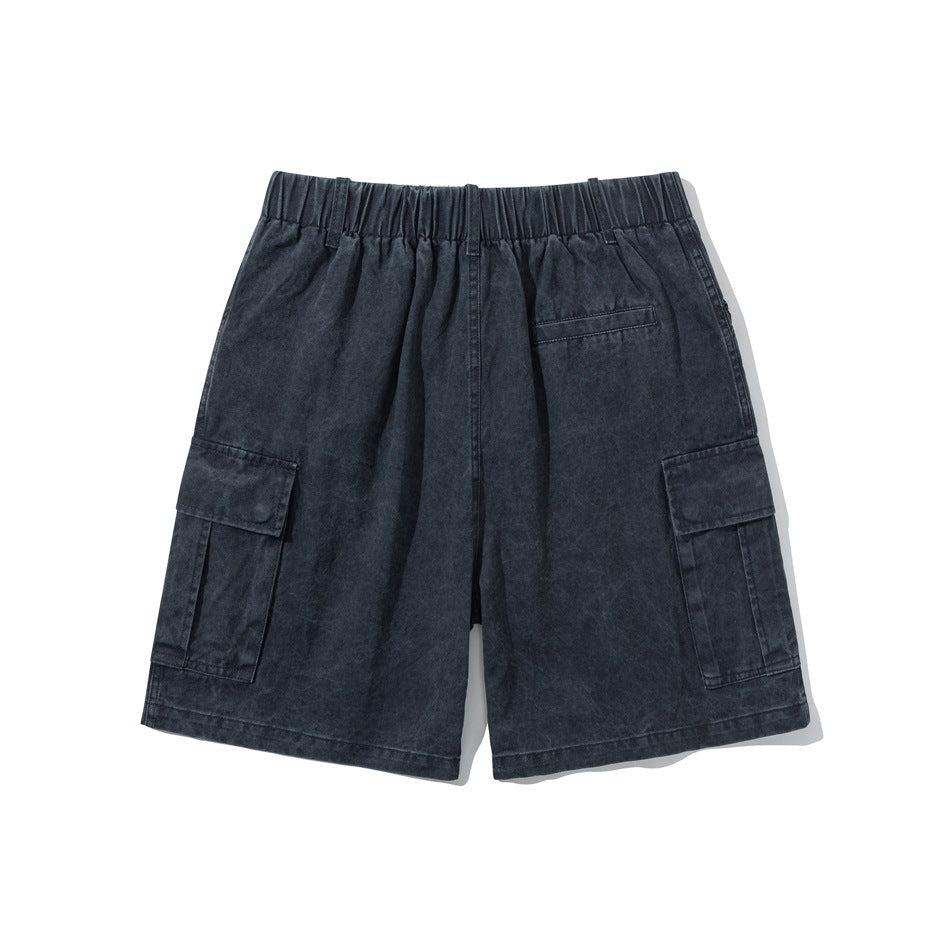 Navy washed cargo shorts flat lay back view with elastic waistband, back welt pocket and side cargo pockets