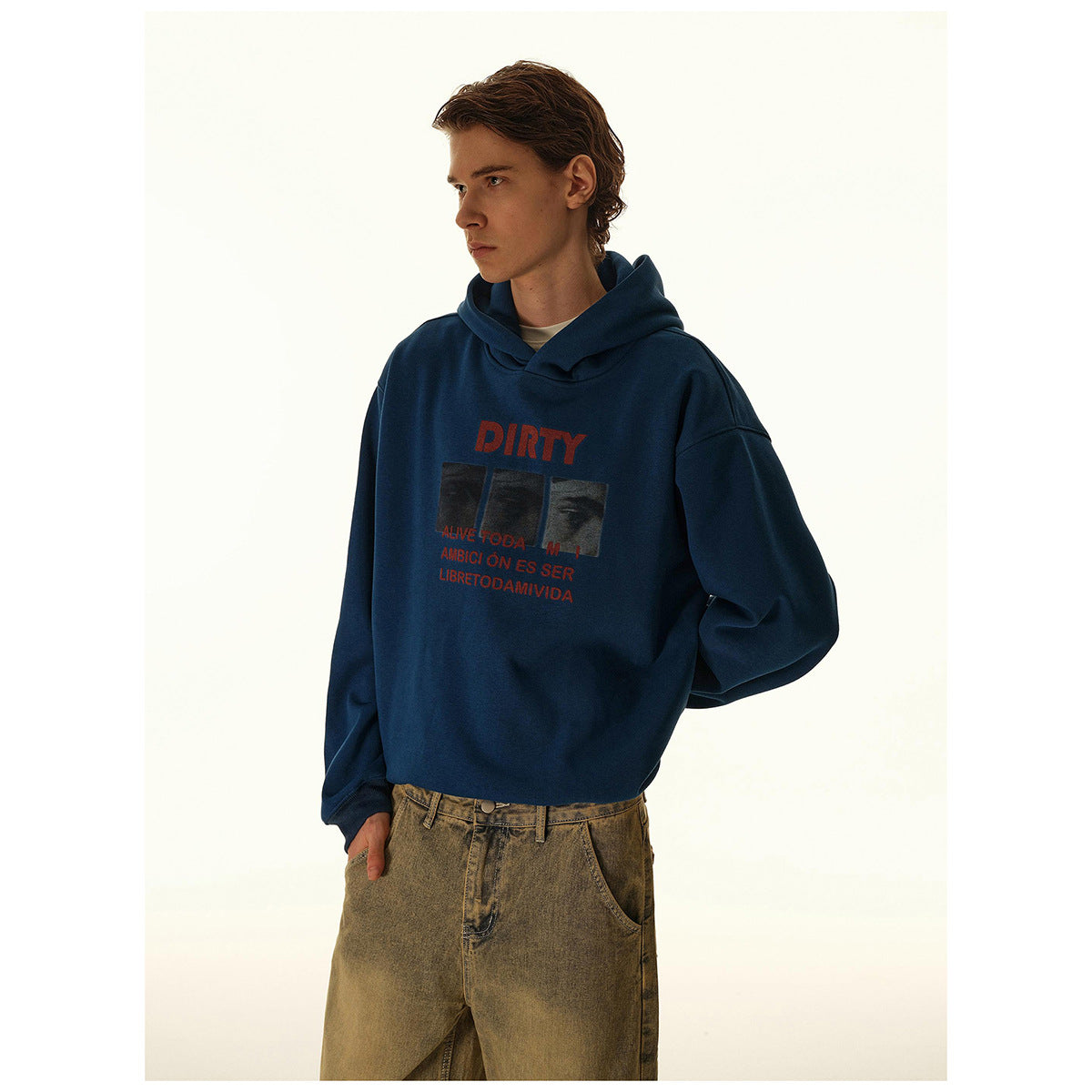 Model wearing a dark blue graphic hoodie, shown from the waist up at an angle.