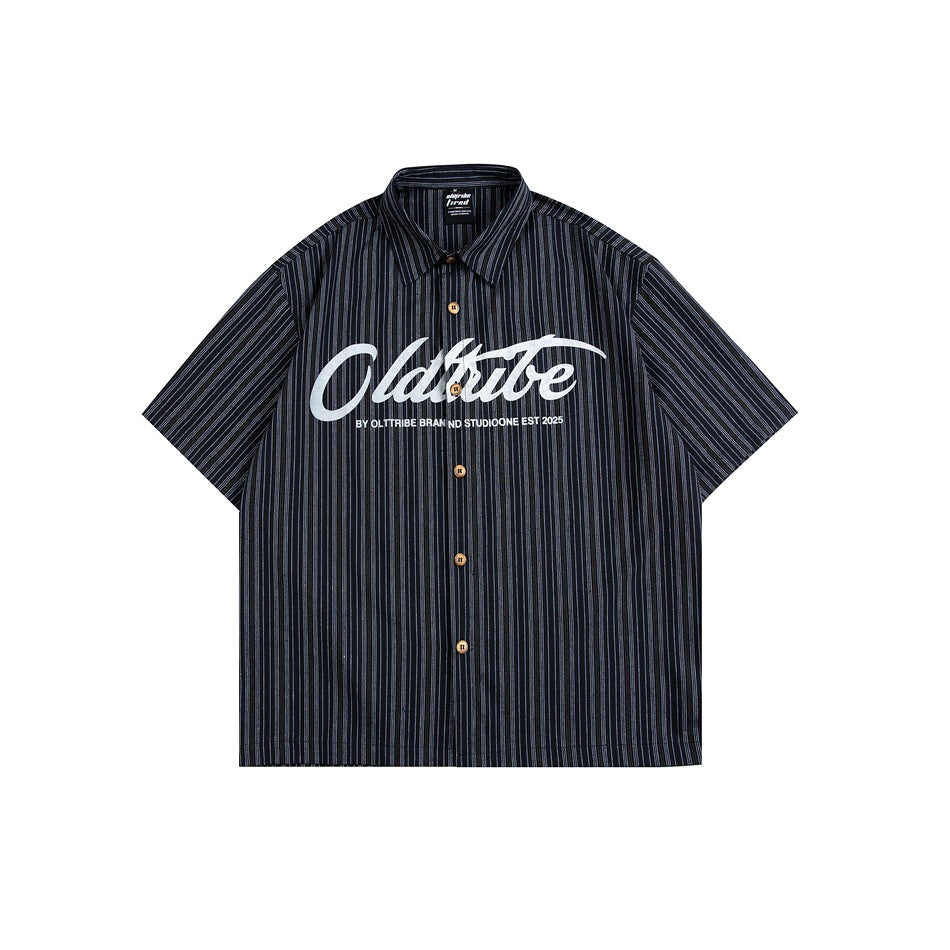 Black and white striped short-sleeve button-up shirt with script lettering graphic on the chest, flat front view