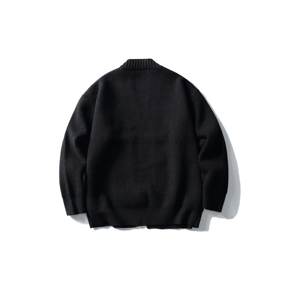 Back view of a black ribbed-knit cardigan with ribbed neckline and long sleeves, shown flat