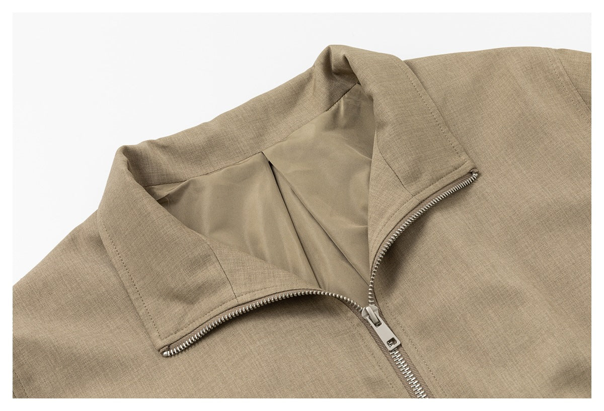 Close-up of the jacket's open stand collar, zipper and smooth inner lining.