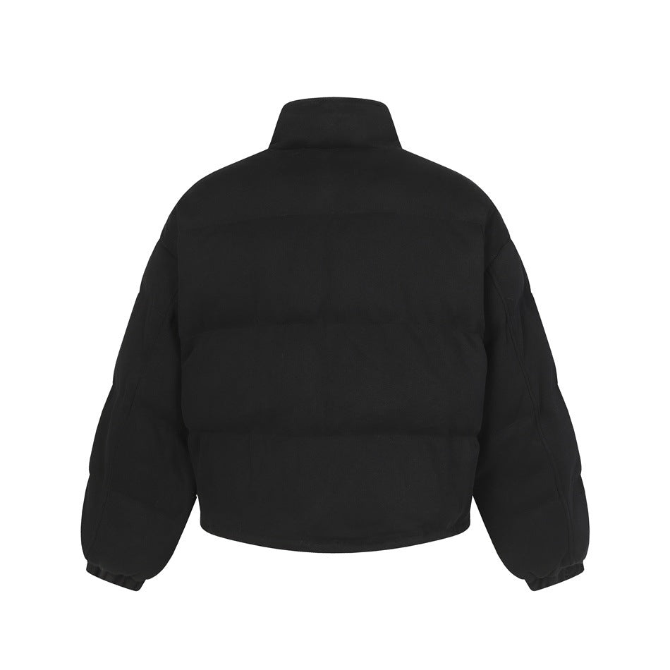 Back view of black cropped puffer-style jacket with stand collar and horizontal quilted panels
