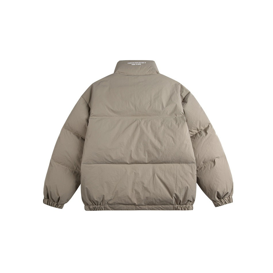 Back view of a light taupe padded jacket with horizontal quilting, a high collar, and elasticated cuffs and hem.