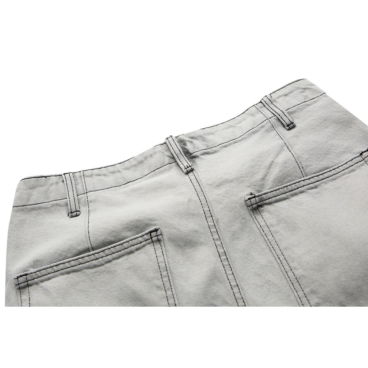 Close-up of the back waistband and pockets of gray washed denim shorts.